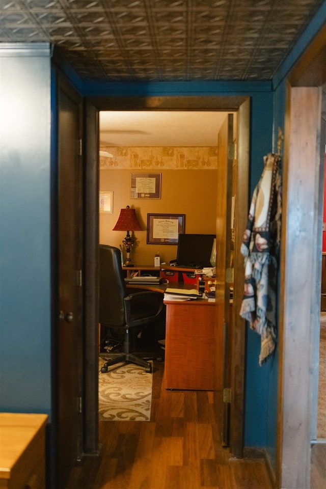 office area with an ornate ceiling and wood finished floors