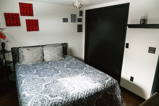 bedroom with visible vents and wood finished floors