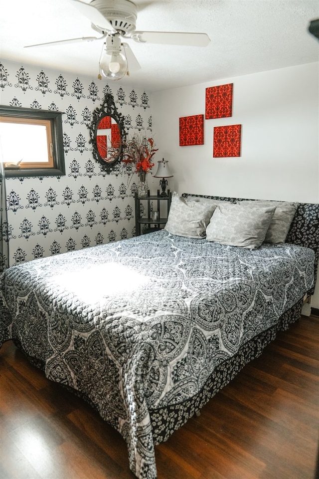 bedroom with ceiling fan and wood finished floors