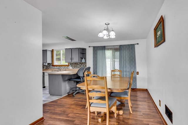 1508 W Hanley Rd, Mansfield, OH 44904 - dining space featuring a chandelier and dark wood-style flooring
