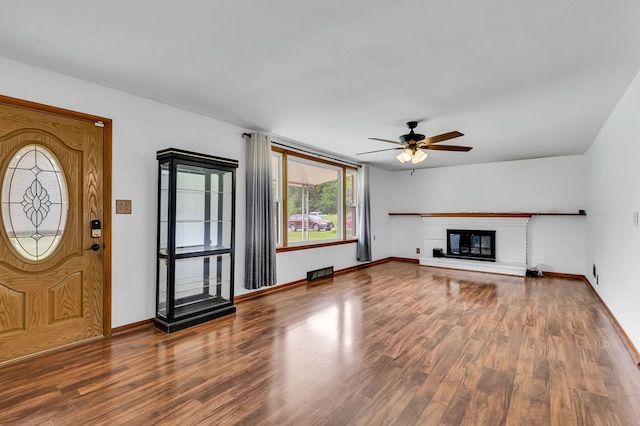 1508 W Hanley Rd, Mansfield, OH 44904 - unfurnished living room featuring wood finished floors, ceiling fan, and a glass covered fireplace