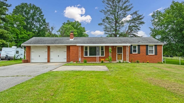 1508 W Hanley Rd, Mansfield, OH 44904 - ranch-style house featuring a garage, brick siding, a front yard, concrete driveway, and a chimney