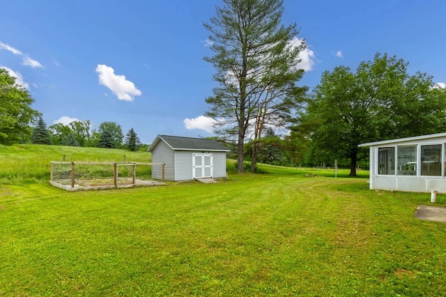1508 W Hanley Rd, Mansfield, OH 44904 - view of green lawn featuring a vegetable garden, a shed, and a sunroom