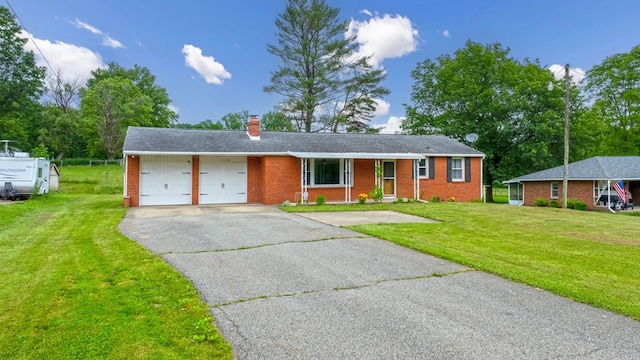 1508 W Hanley Rd, Mansfield, OH 44904 - ranch-style house featuring asphalt driveway, a garage, brick siding, and a front lawn