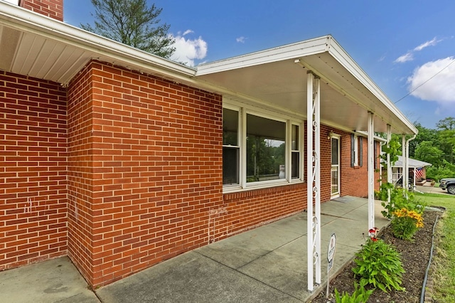 1508 W Hanley Rd, Mansfield, OH 44904 - view of property exterior featuring covered porch and brick siding