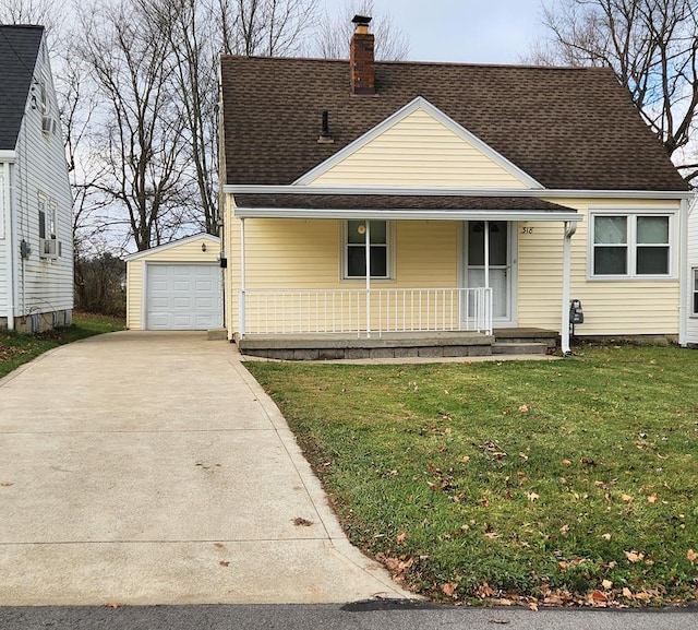 view of front of property featuring a porch, a garage, an outdoor structure, and a front yard