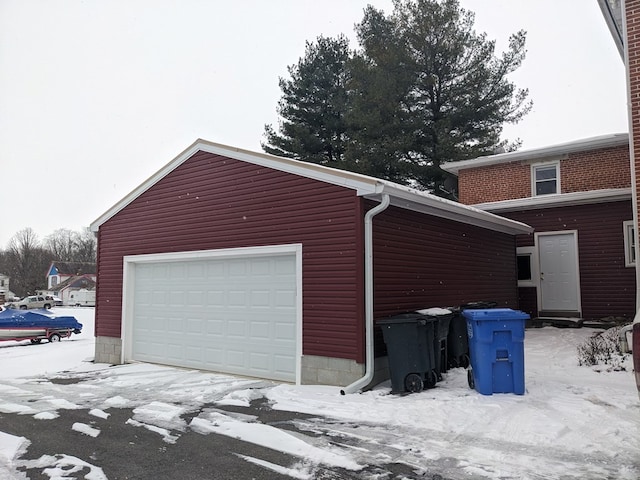 view of snow covered garage