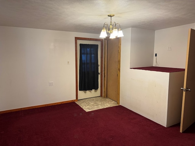 325 E Mansfield St, Bucyrus, OH 44820 - spare room with carpet floors, a chandelier, and a textured ceiling