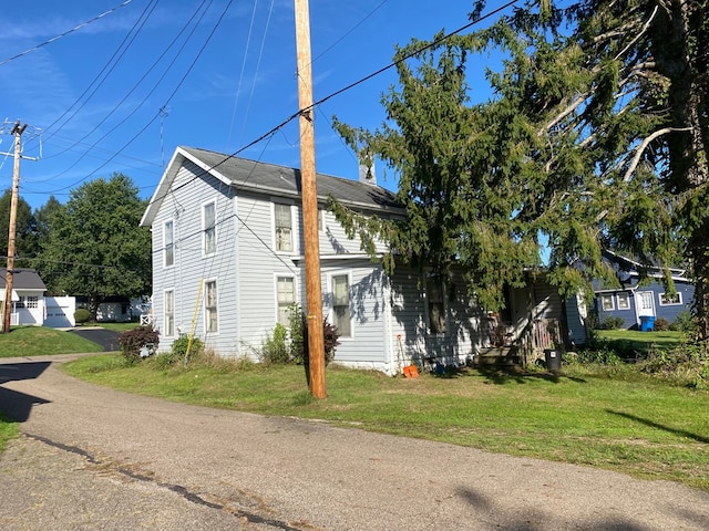 view of property exterior featuring a yard