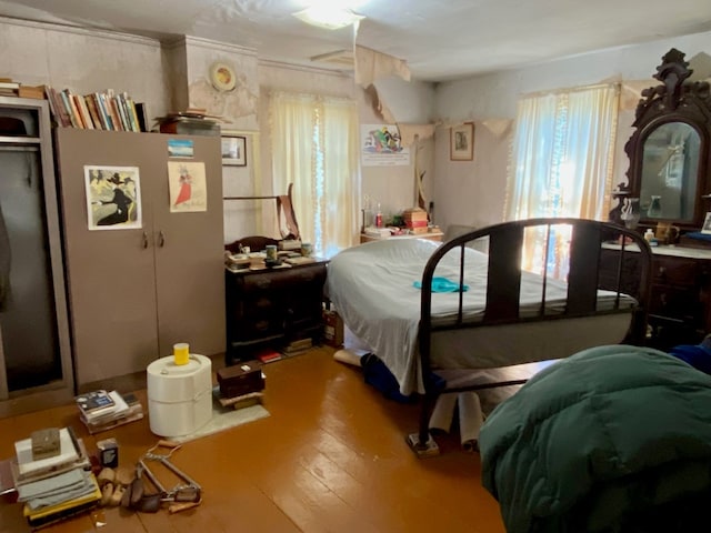 bedroom featuring ceiling fan and hardwood / wood-style floors