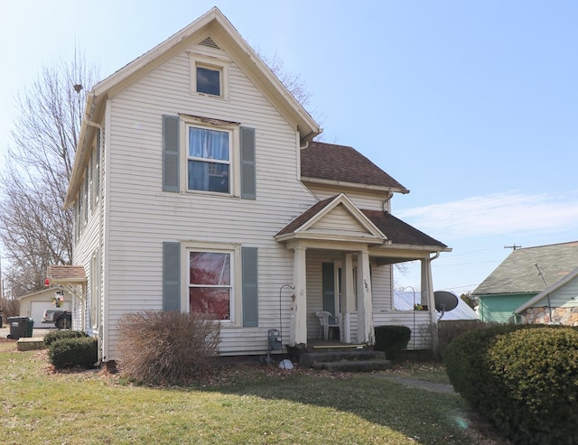 415 W Tiffin St, Willard, OH 44890 - traditional home with a front yard and a shingled roof