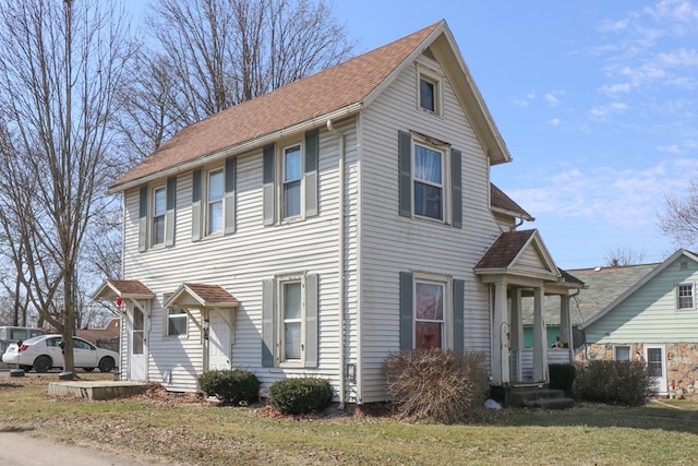 415 W Tiffin St, Willard, OH 44890 - view of front facade with a front yard and a shingled roof
