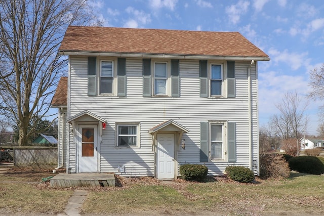 415 W Tiffin St, Willard, OH 44890 - colonial home featuring a front yard and a shingled roof