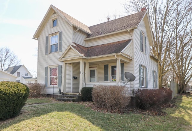 415 W Tiffin St, Willard, OH 44890 - view of front facade with a shingled roof and a front yard