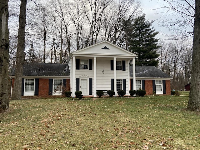 neoclassical home with a front lawn