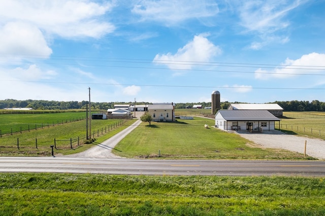 exterior space with a front yard and a rural view