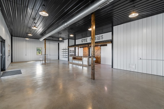 garage with wood walls