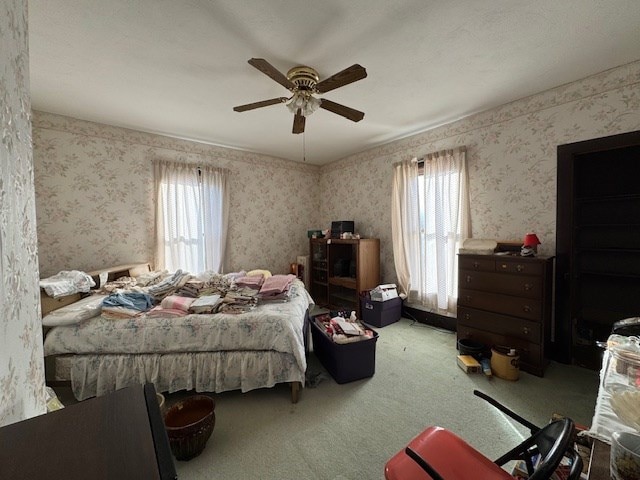 bedroom featuring ceiling fan and carpet floors