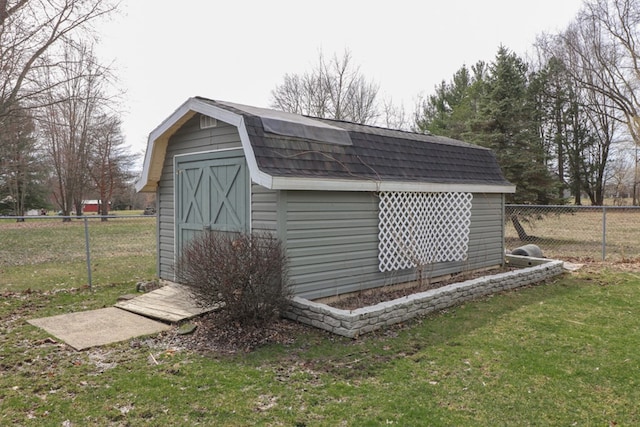 view of shed featuring fence