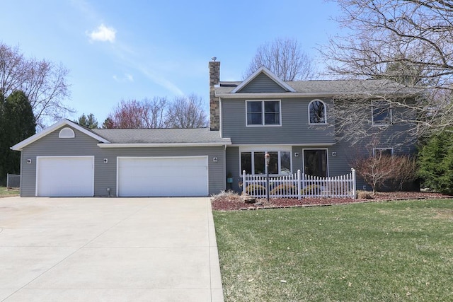 traditional-style house featuring an attached garage, a chimney, a front lawn, and concrete driveway