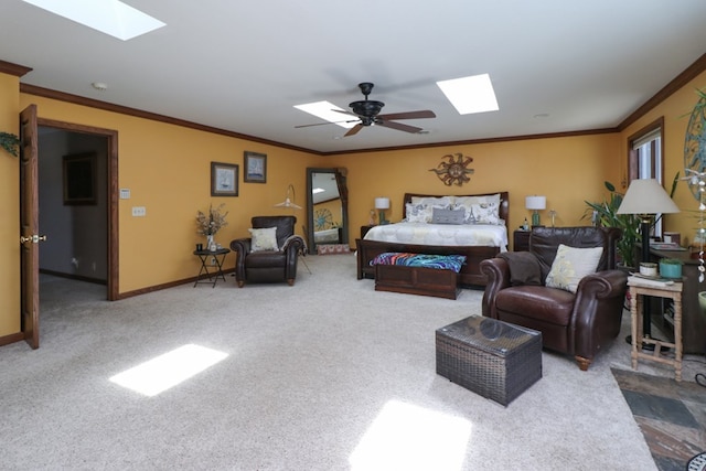 carpeted bedroom with baseboards, ornamental molding, and a skylight