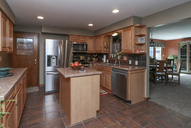 kitchen featuring open shelves, stainless steel appliances, a center island, a sink, and dark carpet