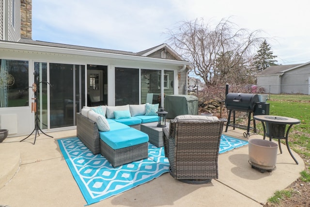 view of patio featuring a grill, an outdoor living space, and fence