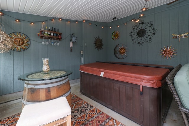 exterior space with a hot tub