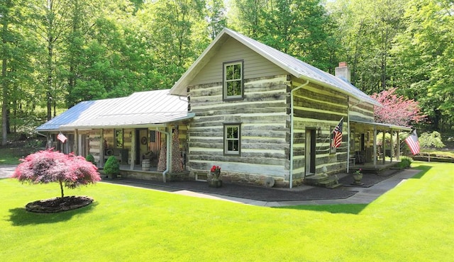 609 Mcbride Rd, Mansfield, OH 44905 - view of front of property featuring a porch, a front lawn, and metal roof