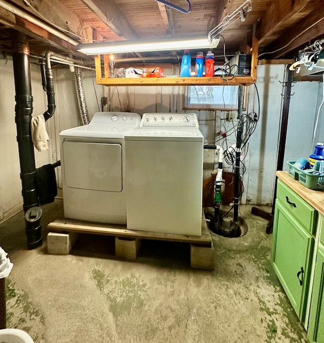 laundry room with washing machine and clothes dryer