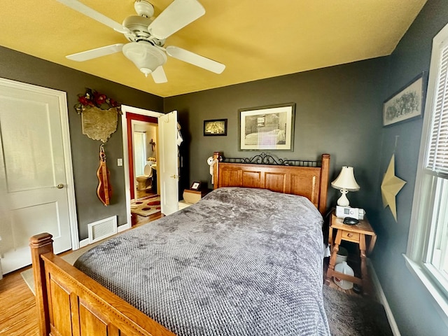 bedroom with ceiling fan and light hardwood / wood-style floors