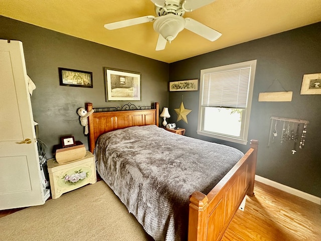 bedroom featuring light wood-type flooring and ceiling fan