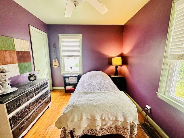 bedroom featuring ceiling fan and light hardwood / wood-style floors