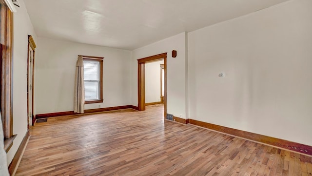 unfurnished room with light hardwood / wood-style flooring