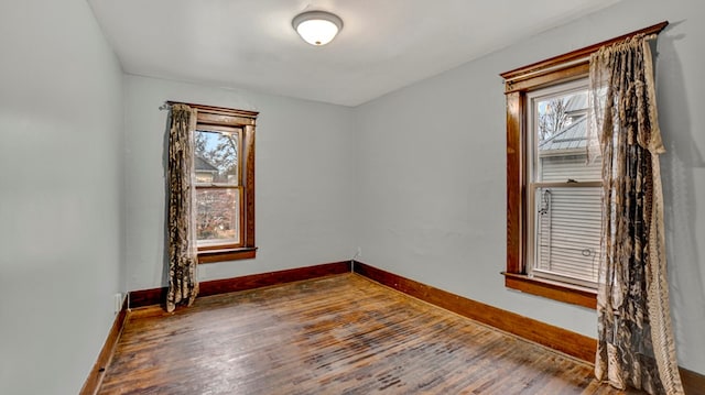 unfurnished room featuring hardwood / wood-style floors