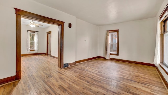 spare room featuring ceiling fan and light wood-type flooring