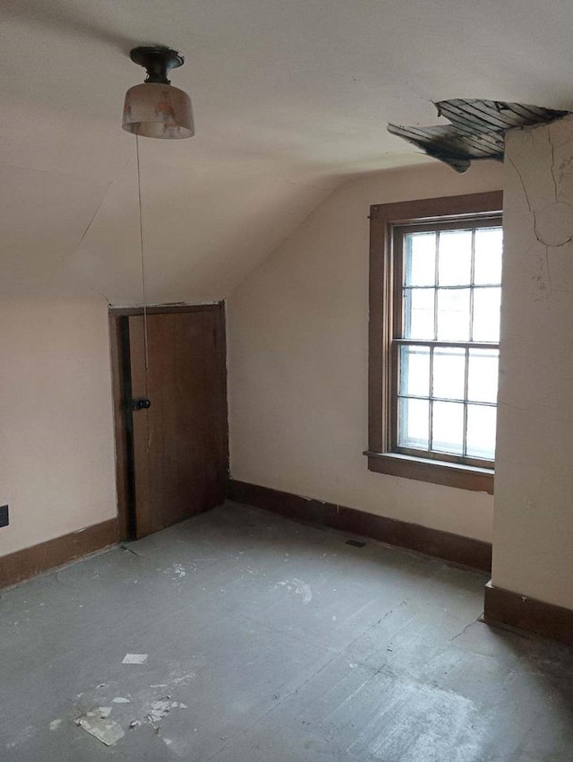 bonus room featuring vaulted ceiling