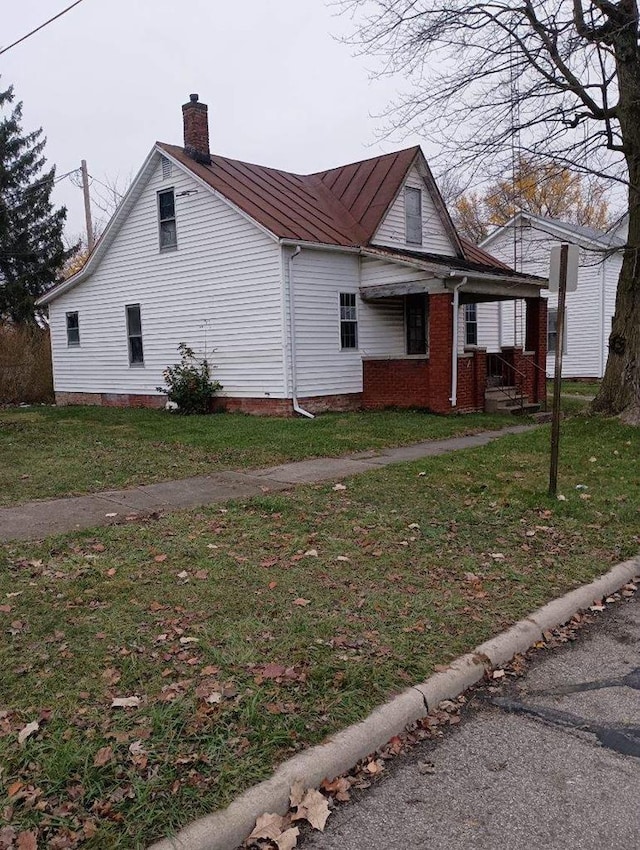 view of home's exterior featuring a yard