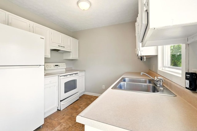 560 Harlan Rd, Mansfield, OH 44843 - kitchen with white appliances, a sink, under cabinet range hood, white cabinets, and light countertops