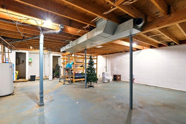 560 Harlan Rd, Mansfield, OH 44843 - unfinished basement with electric water heater and concrete block wall