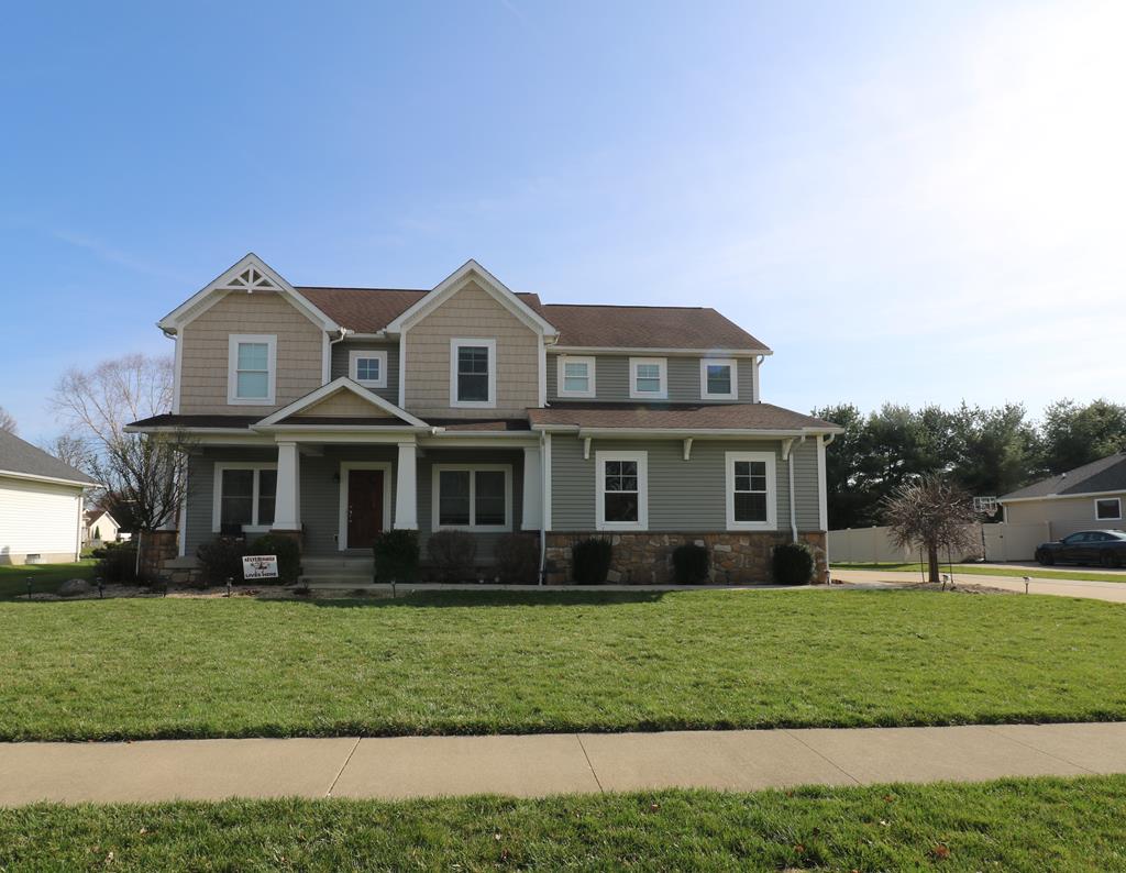10 Queen Anne Way, Norwalk, OH 44857 - craftsman-style home with stone siding and a front yard