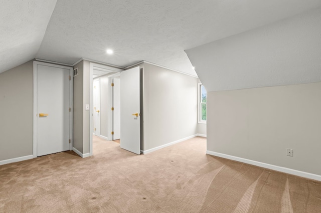 bonus room with carpet floors, lofted ceiling, baseboards, a textured ceiling, and recessed lighting