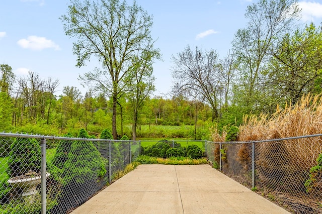 view of patio featuring fence