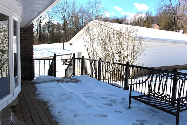 view of snow covered deck