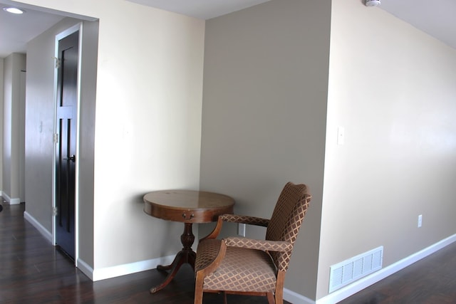 living area with dark hardwood / wood-style flooring