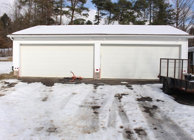 view of snow covered garage