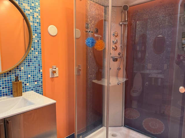 380 Tidd Dr, Galion, OH 44833 - full bathroom featuring a stall shower, vanity, tile walls, and tasteful backsplash