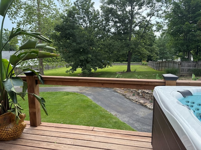 380 Tidd Dr, Galion, OH 44833 - view of yard featuring a hot tub, a deck, and view of wooded area