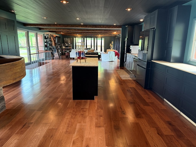 380 Tidd Dr, Galion, OH 44833 - kitchen with fridge, light countertops, recessed lighting, open floor plan, and dark wood-style flooring