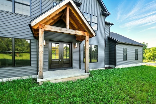 1360 Lexington Ontario Rd, Mansfield, OH 44904 - view of exterior entry with french doors and a yard